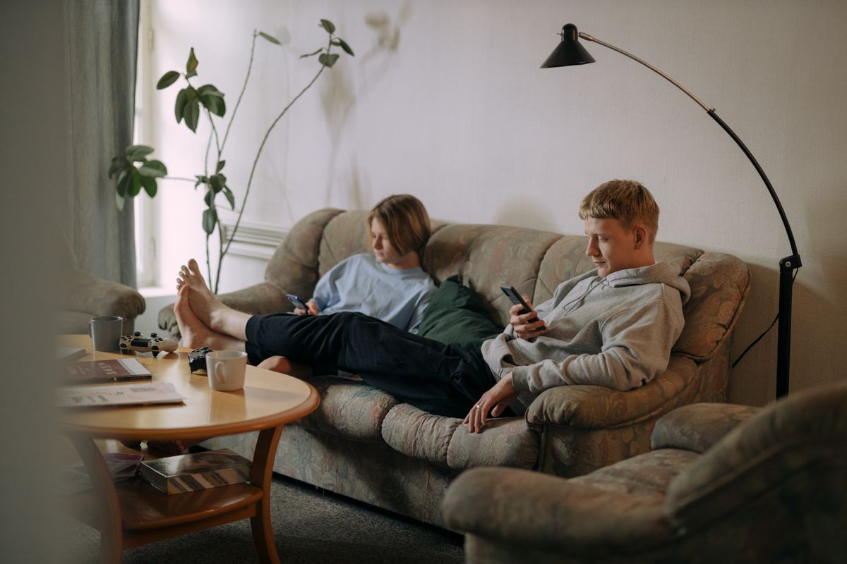 People using their devices at home
